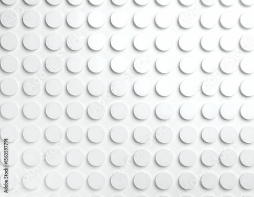 A pristine white surface adorned with an orderly array of raised circular studs creating a clean abstract pattern.