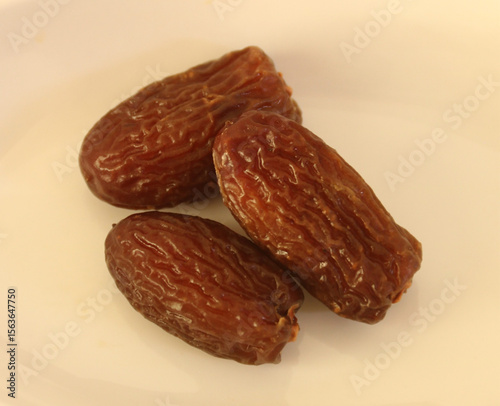 Dried dates isolated on white background