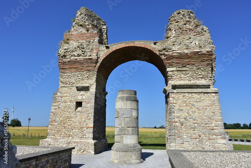 ruins of triumphal arch of Roman city in fields near capital city Vienna in Austria