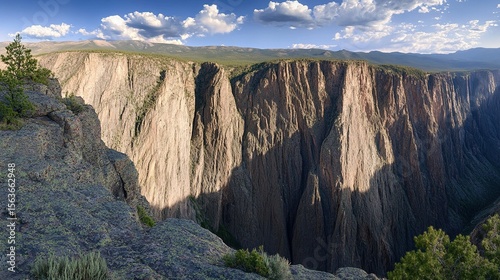 Black Canyon of the Gunnison sheer cliff depth with shadow play on rock for geology contrasts, Colorado tourism photo