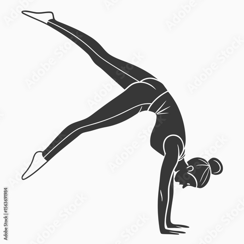 Young Woman in Gray Activewear Performing a Gymnastics Pose