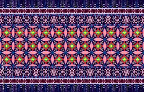 Mexican indian design with tribal ethnic themes on a geometric seamless background Beautiful textile print with native American tribal elements in an ethnic traditional style. Folk fashion from Mexico