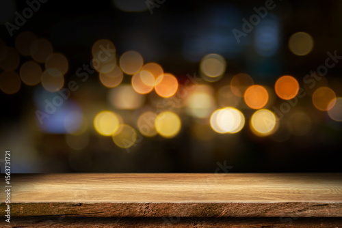 Empty wooden table with bokeh and blur restaurant background, for your photo montage or product display, Space for placing items on the table, product and food display.