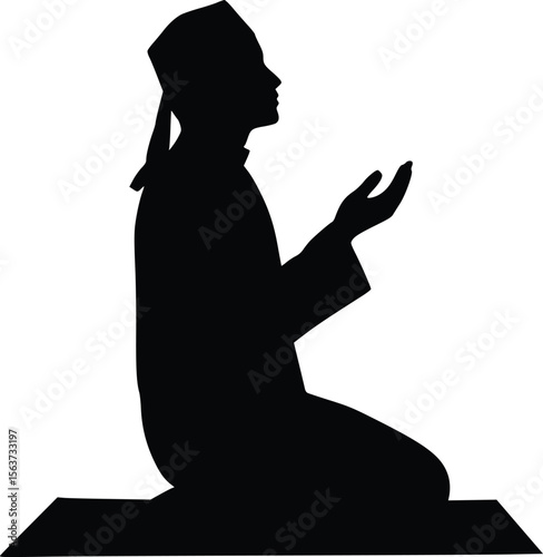 Silhouette of a person kneeling in a prayer position, hands together, wearing traditional religious attire