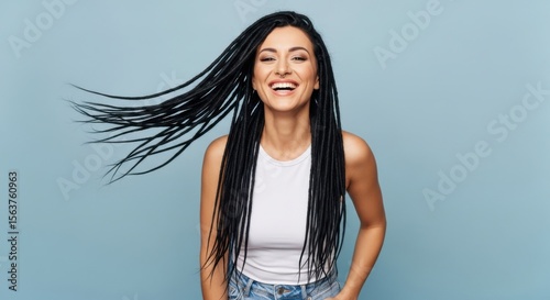 Young Woman With Long Black Dreadlocks Smiling And Laughing