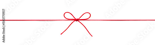 Obraz na plátně A Simple Red Bow Tied Around a Thin Red Line Across a Black Background