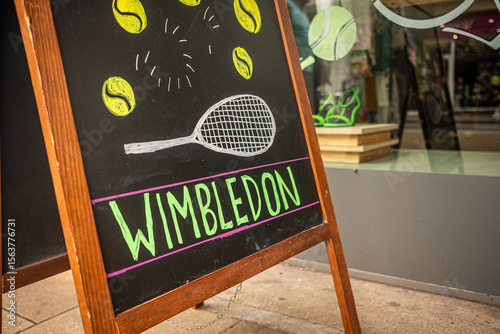 Wimbledon, London-  High street shop with Wimbledon tennis illustration on blackboard