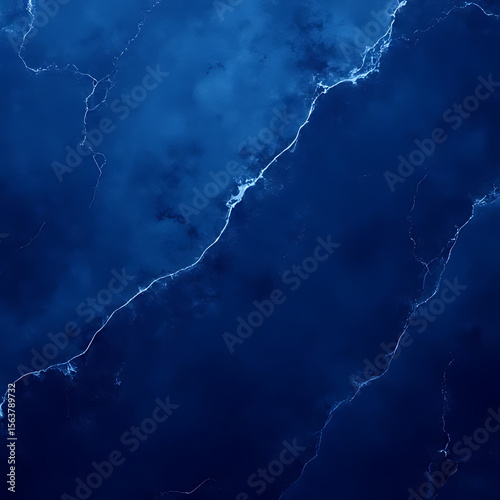 Dark blue abstract background with white veins resembling marble or stone texture with cloud-like formations and gradients
