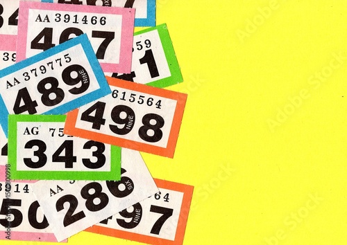 Vintage raffle tickets on a bright coloured background.