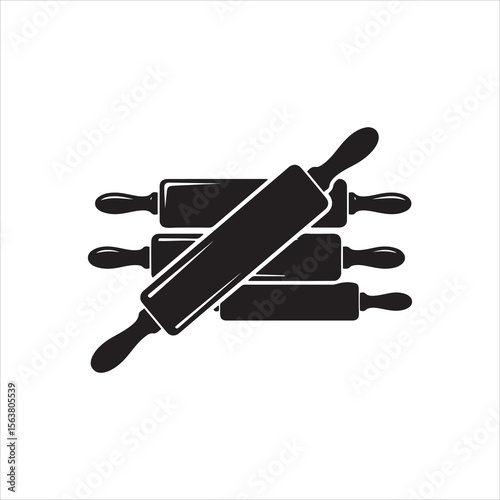 Group of black rolling pins with handles arranged artistically on white background
