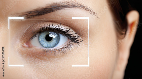 Close up of blue eye with digital interface overlay symbolizes intersection of technology and cybersecurity