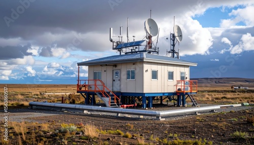 Communication Station on Remote Landscape with Dramatic Sky