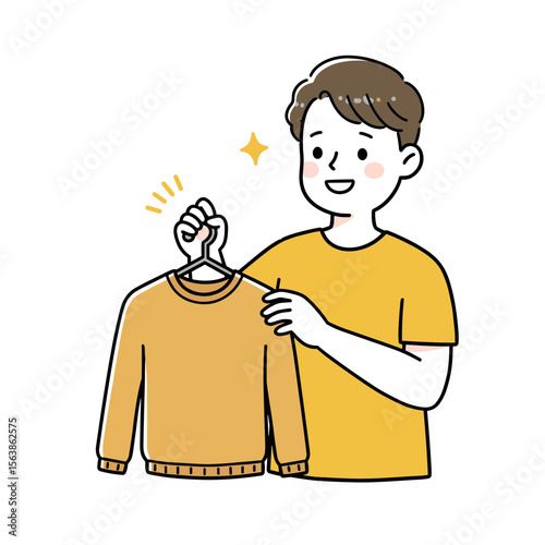 Boy with hanger holding clothing item. Perfect for organizing closet space, laundry care, and wardrobe management tips.