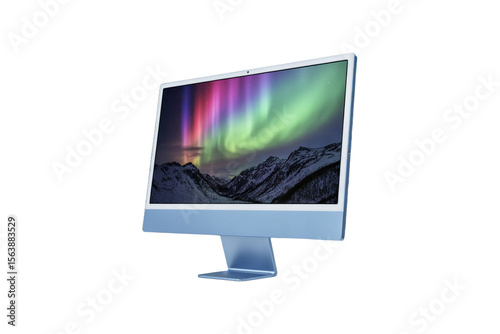 Modern computer monitor displaying a vibrant aurora borealis over snow capped mountains