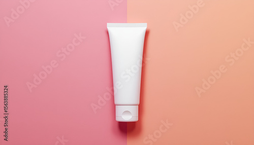 Wallpaper Mural Blank white cosmetic cream tube mockup on a split background of pink and peach colors showcasing product packaging design presentation and beauty marketing. Torontodigital.ca