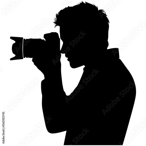 Silhouette of a person holding a camera to eye