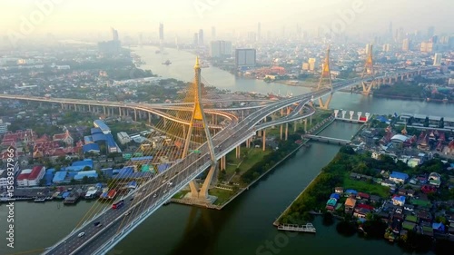 The bhumibol bridge spans the chao phraya river in bangkok