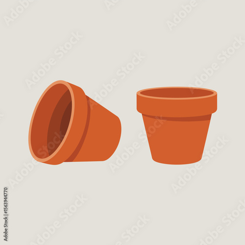 Two terracotta clay pots one upright and one tilted on its side