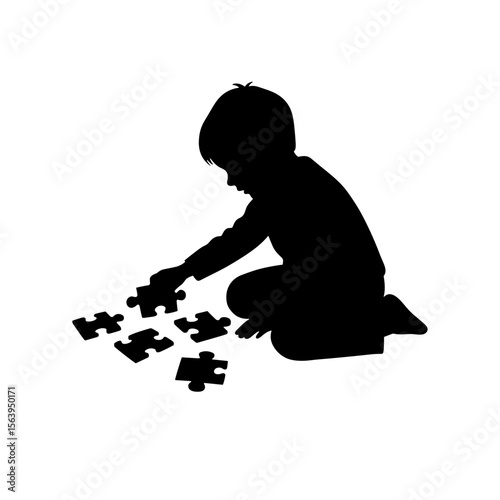 Child playing with puzzle pieces while kneeling on the floor  