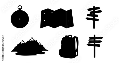 Silhouette image showing camping and hiking equipment including compass map and backpack and mountains