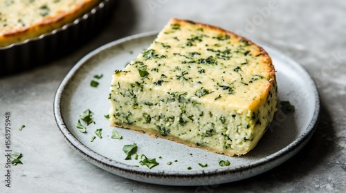 Sformato di Verdure, baked vegetable flan (e.g., zucchini or spinach), light and airy, slice on a plate, showing texture, simple elegant peasant dish.