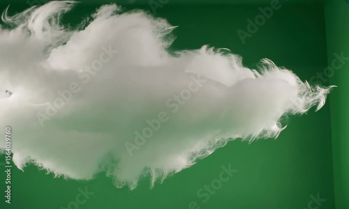 White Fluffy Cloud Against A Vibrant Green Backdrop In A Studio Setting