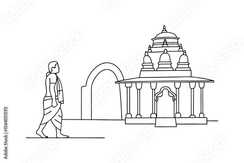 Man walking towards ancient temple with arched gateway