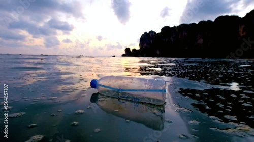 A plastic bottle floats in the sea, illustrating ocean pollution