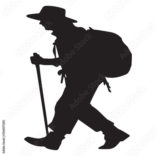 Silhouette of a hiker wearing a hat and carrying a backpack with a walking stick
