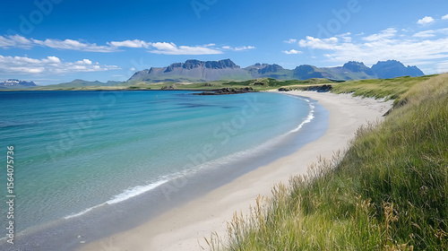 Tranquil beach landscape in iceland with crystal clear water and mountain backdrop