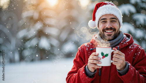 Joyful man sipping Christmas mug in snowy wonderland, festive spirit