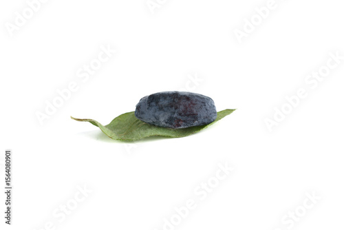 Ripe honeysuckle berry on honeysuckle leaf and over white background.