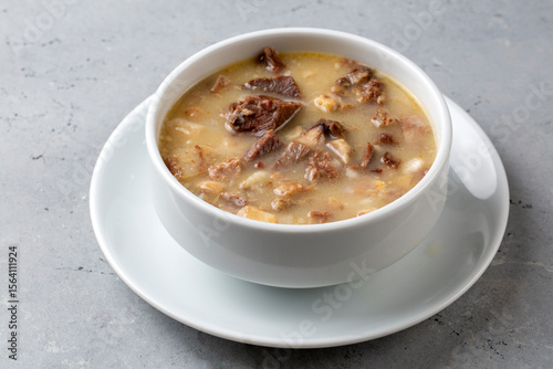 Traditional delicious Turkish food, Turkish traditional tripe soup; iskembe corbasi and offal soup, Turkish Meat Soup Kelle Paca (Turkish name; Kelle paca corbasi)