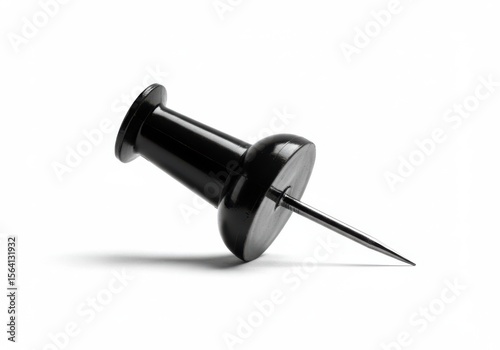 A black thumbtack isolated on white background
