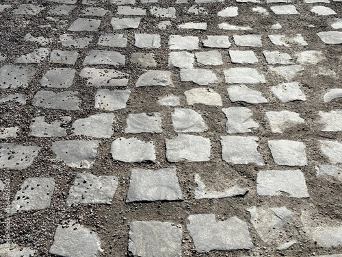 Old stone pavement cobblestone road.