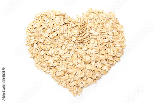 heart shape of rolled oats isolated white background