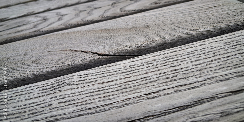 Fototapeta premium Close-up of weathered wooden planks with textured wavy lines