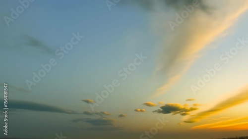 Clouds Moving Slowly Across Blue Sky Early Evening