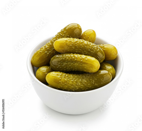 Beautiful pickled cucumbers of small size in a bowl isolated on white