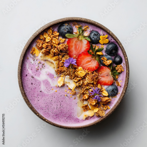 Vegan Smoothie Bowl – Ultra-realistic purple smoothie bowl topped with granola, fresh berries, and edible flowers. Perfect for healthy food, plant-based diet, and breakfast inspiration.
