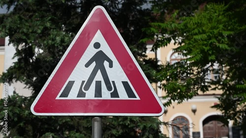 Traffic sign for a pedestrian crossing.