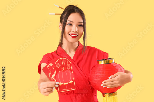 Young Asian woman with enve...