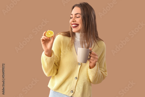 Young woman with lemon and ...