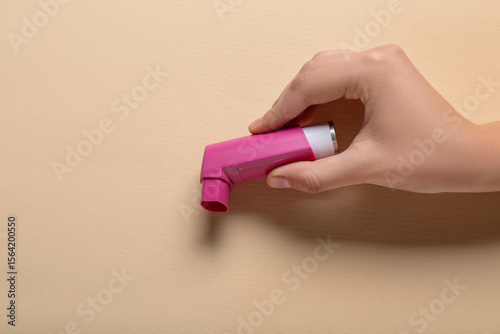 Child's hand with asthma in...