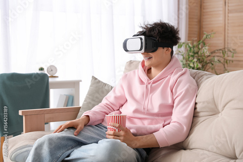 Young man in VR glasses wit...