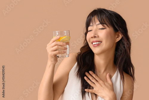 Young Asian woman with citr...