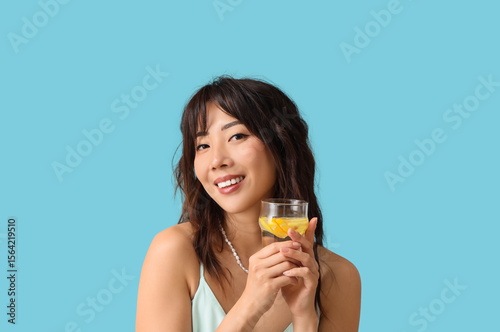 Young Asian woman with citr...