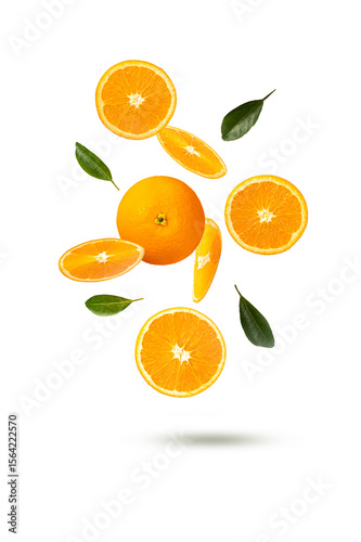 falling oranges fruits with slice and leaves isolated on white background.