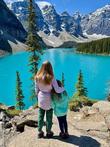 Wallpaper Mural Woman and girl standing in front of turquoise Moraine Lake and mountains in Banff Torontodigital.ca