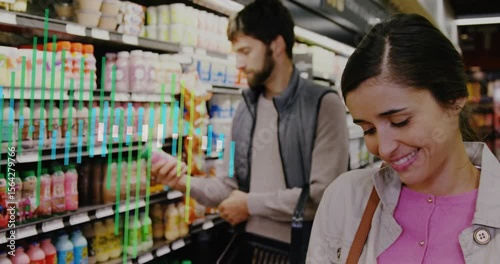 Wallpaper Mural Woman reaching pink drink in store aisle reading nutrition label while man comparing juice labels Torontodigital.ca